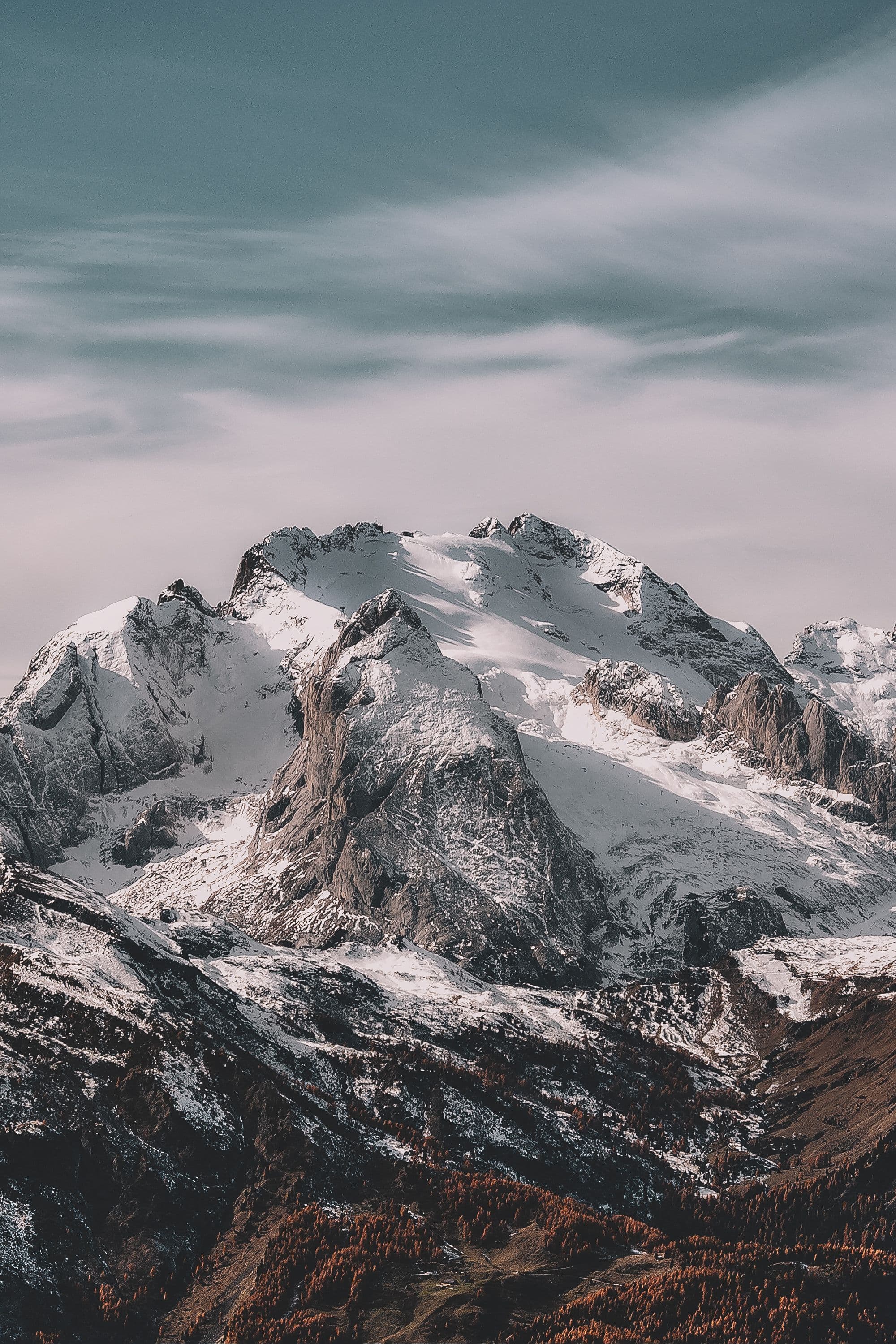 Snow-covered alpine peaks above a valley